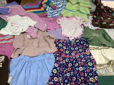 Cute little girl clothes going in to a quilt